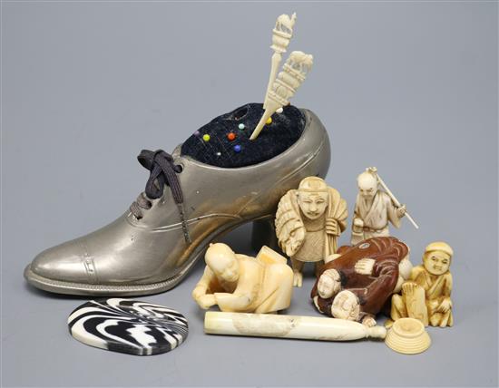 A group of Oriental ivory and bone netsuke, carvings etc and a pewter shoe pin cushion
